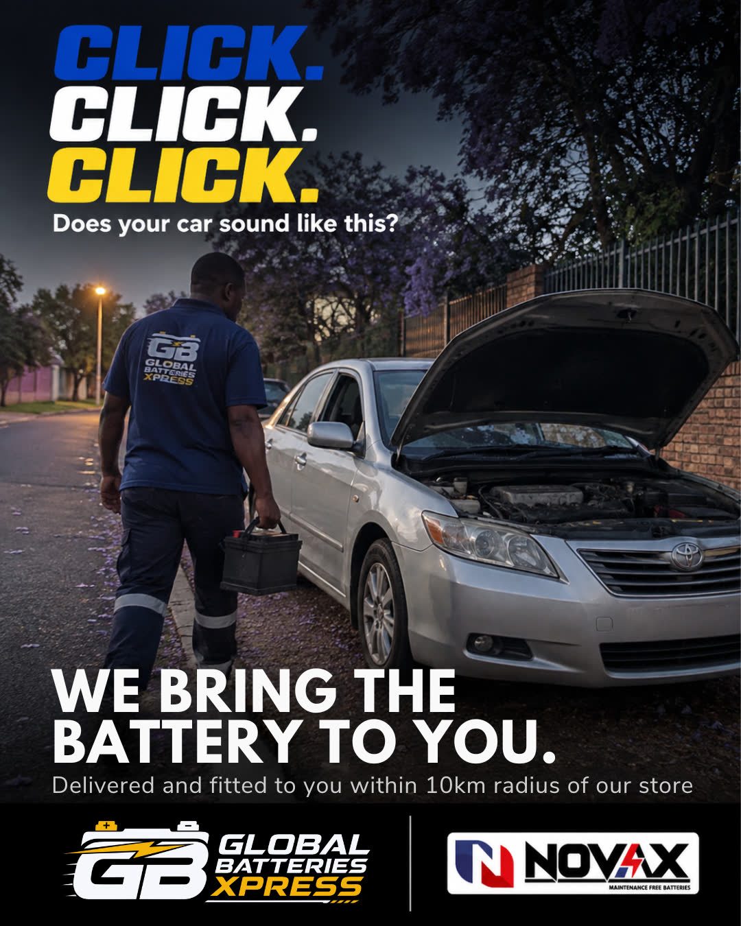 A Global Batteries Xpress technician carrying a battery to a car at the roadside